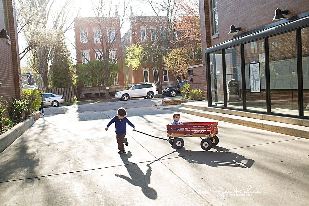 Chicago IL Family Lifestyle Photos Boy Pulling Wagon
